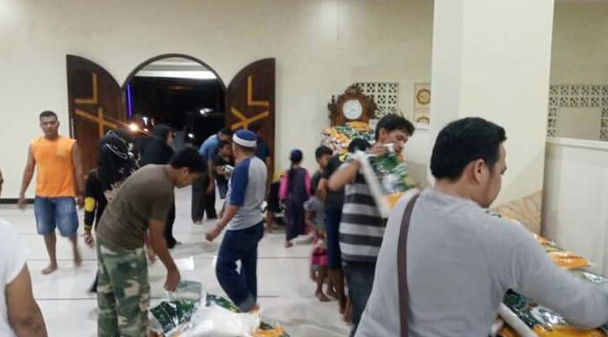 Suasana Persiapan Distribusi Beras dan Uang Tunai