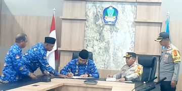 penandatanganan NPHD Bupati dan Kapolres Halsel