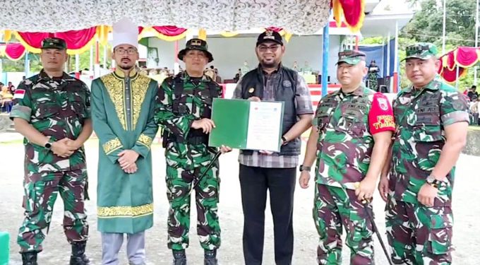 Bupati Bassam Menerima BA Penyerahan Hasil TMMD dari Dandim 1509 Labuha